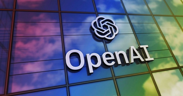 Renkli cam cephe üzerinde OpenAI logosu ve yazısı