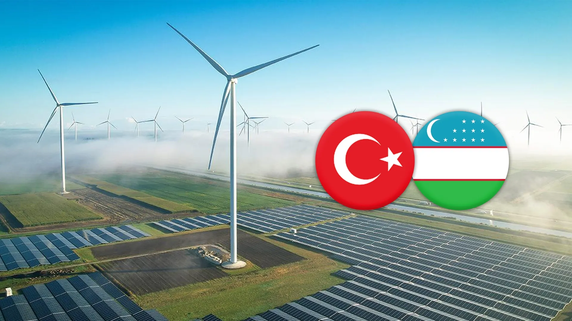 Rüzgâr türbinleri ve güneş paneli tarlası üzerinde Türkiye ve Özbekistan bayrakları